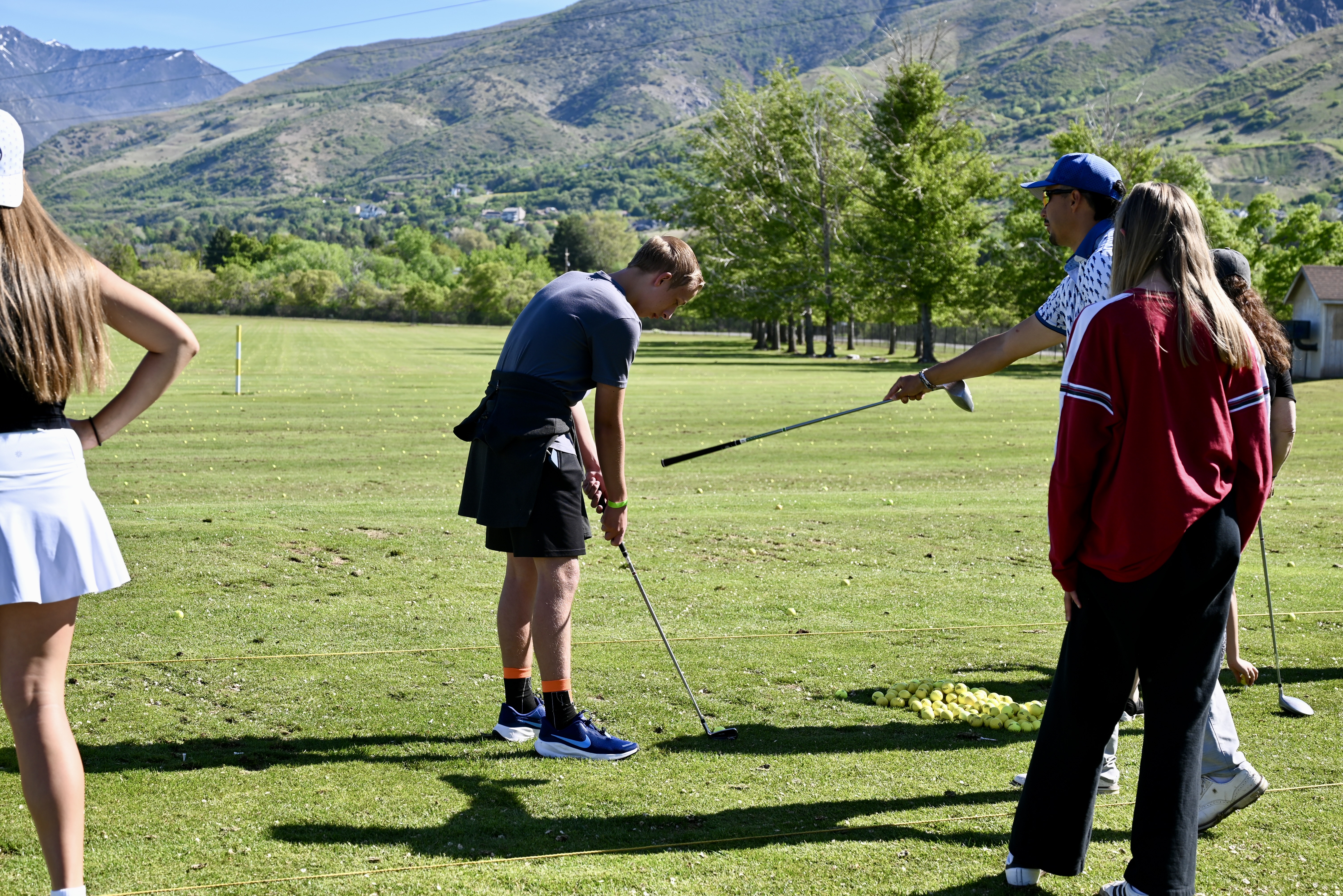 Driving range instruction with mountain views