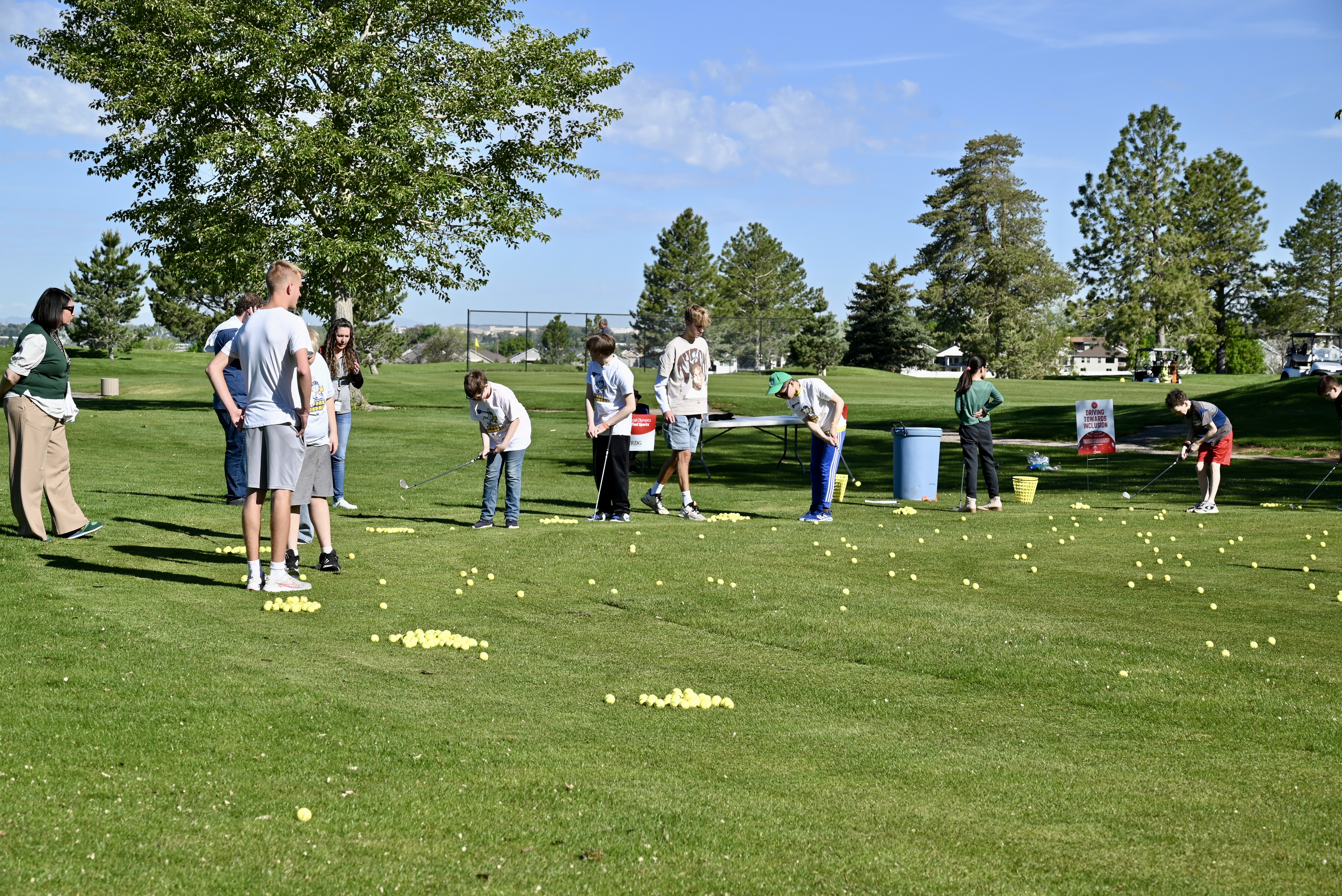 Participants lined up on the driving range